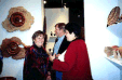Collectors, Doris & Harry Wolin looking at Dennis Elliott work